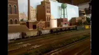 N Scale Conrail Freight Runs Past Bob Mohr's Factory Scene