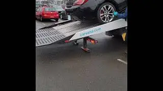 New Car Falls Off Trailer's Ramp With Thud During Delivery