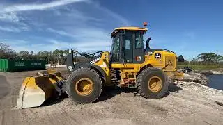 A John deer front loader parked up.