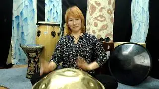 Girl playing the Golden handpan