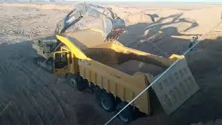 Volvo excavator pulling MT-86 Dump truck in Mongolia
