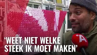 Buren maken borduurwerk om ‘lelijke’ gevel weg te werken
