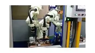 DUAL ROBOTIC WIELDING CELL