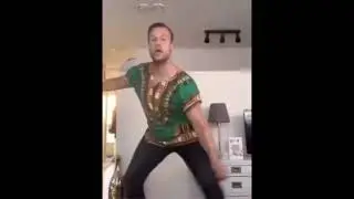 white guy dancing in African Clothing  | spriteuser000