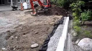 Système de drainage d'un mur de soutènement