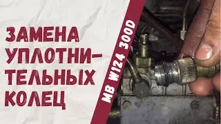 Replacing the sealing rings under the fuel injection pump fittings on a Mercedes-Benz W124 300D.