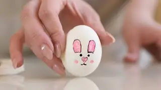 Drawing a Pink Bunny on an Easter Egg