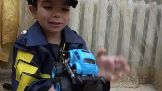 Andrew plays police cars and save cars toys from the cave