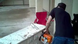 cutting a dresser with a chainsaw