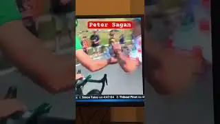 Peter Sagan giving an autograph WHILE racing the Tour de France!