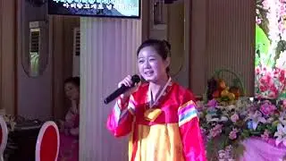 Girl sings to us during lunch in Pyongyang/ North Korea