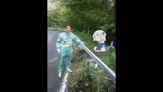 Man in green suit points at spinning Gawr Gura