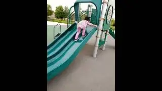 James Cheng and Jacqueline Cheng children playground slide climbing upward