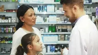 Little Daughter with Her Mom Consult with the a Pharmacist | Stock Footage - Videohive