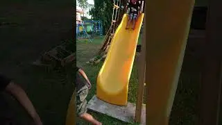 Dale and Niño at the yellow slide