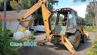 Setting a Propane Tank with a Case 580 Backhoe