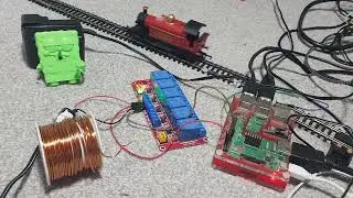 Operating a model train using a relay system and a r-pi