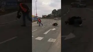 Hilarious moment Just Stop Oil protester slips in liquid she is pouring onto road