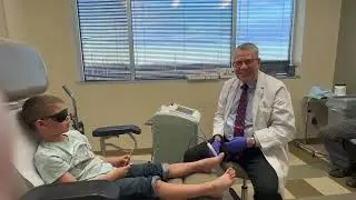 Severe toenail fungus in young boy treated with laser.