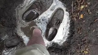 Seven pairs of plimsolls ( canvas sneakers ) trashed in mud.