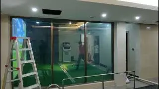 The customer's indoor golf simulator is installed, and you can swim after playing