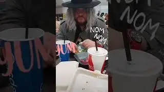 Lady Dimitrescu and Heisenberg eating cosplay from Resident Evil Village
