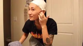 Woman shaving head