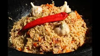 Плов в казане.Pilaf in a cauldron.