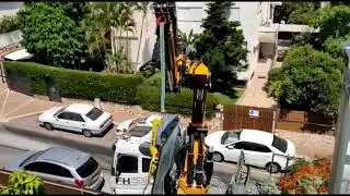 תיקרת זכוכית - הנפת זכוכית במנוף ונטוזה