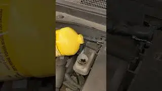 Adding brake fluid to the master cylinder reservoir on a 2012 Chevy Equinox 3.0L V6 Prestone DOT3