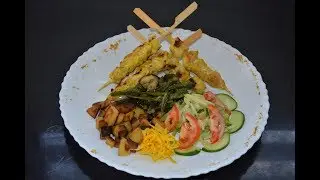 BROCHETTES DE POULET MARINÉE A LA MANGUE VERT, ET POÊLÉE DE LÉGUME