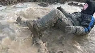 Snowsuit in thick and heavy mud
