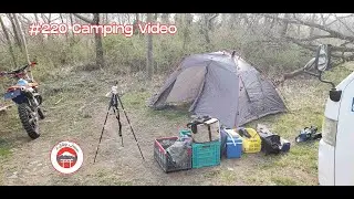 #220 camping, man rambling next to a fire