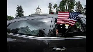 Demonstrators drive around the California state Capitol protesting state stay-at-home orders