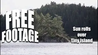 Copyrightfree Stock footage Sun rolles over a tiny island on a lake