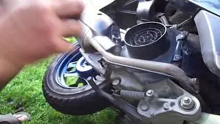 How to remove the rear wheel on a scooter?