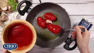 Spaghetti con pelati e pesto