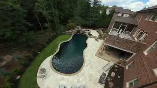 Curvilinear Pool with Elegant Rock Waterfalls and Sophisticated Design | Luxury Home Pools