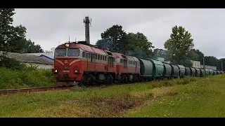 Diesel locomotive 2M62K-1059 with a freight train