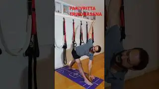PARIVRITTA TRIKONASANA. Release your back.