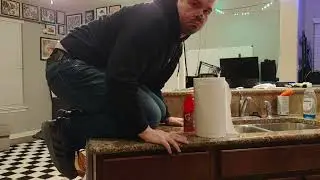 Cat man knocks over stuff