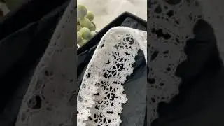 Шерстяное кружево, сплетенное на коклюшках.