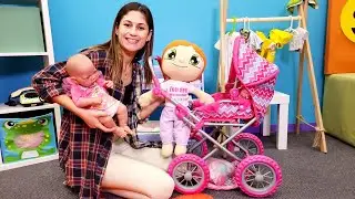 Kız oyunları.  Ayşe ve Lili bebeği Ela ile dışarı çıkma hazırlıkları yapıyor. Bebek bakma oyunu