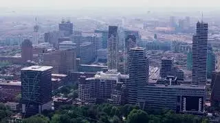 Aerial view of The Hague's modern skyline with skyscrapers, including New Babylon business center