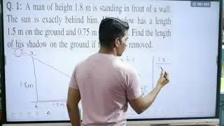 A man of height 1.8 m is standing in front of a wall. The sun is exactly behind him. His shadow has