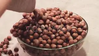 Hazelnut Poured Out of the Sack Into Glass Bowl | Stock Footage