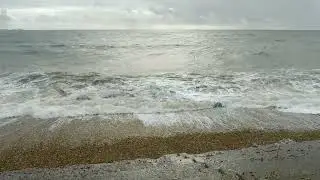 Waves from the incoming tide on the beach at Milford on Sea Hampshire England 22.10.24