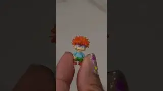 Mini Toy Brands Chuckie vs. Funko Pop! Chuckie