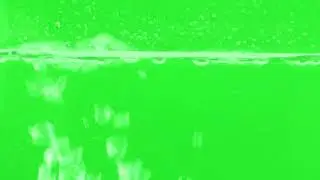 Bubbling water on a green background Video