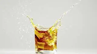 Two Ice Cubes Falling Into Glass with Bourbon. | Stock Footage - Videohive